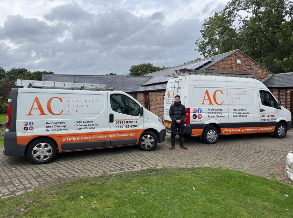 Conor Bentley Standing Infront of vans owned by AC Exterior Clean LTD